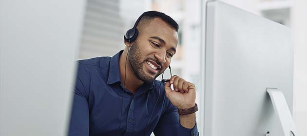 telemarketer smiling with headset