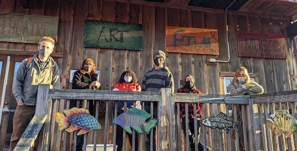 Six staff members of Epoch Arts in East Hampton, CT stand in front of their building.