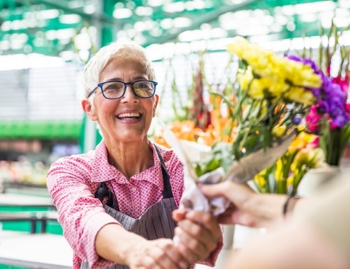 Woman buying flowers