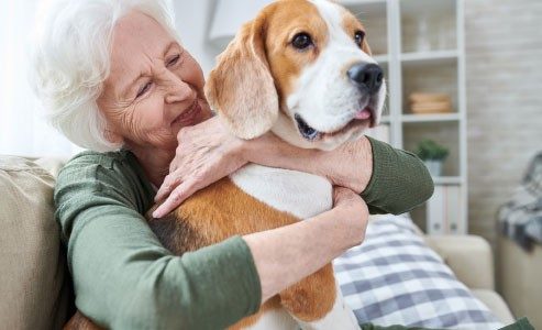 older woman and dog