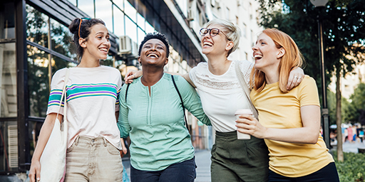 Group of people smiling and walking together